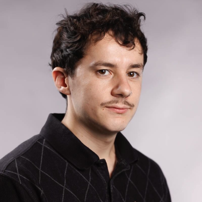 A headshot of Jack Walker wearing a collared shirt.